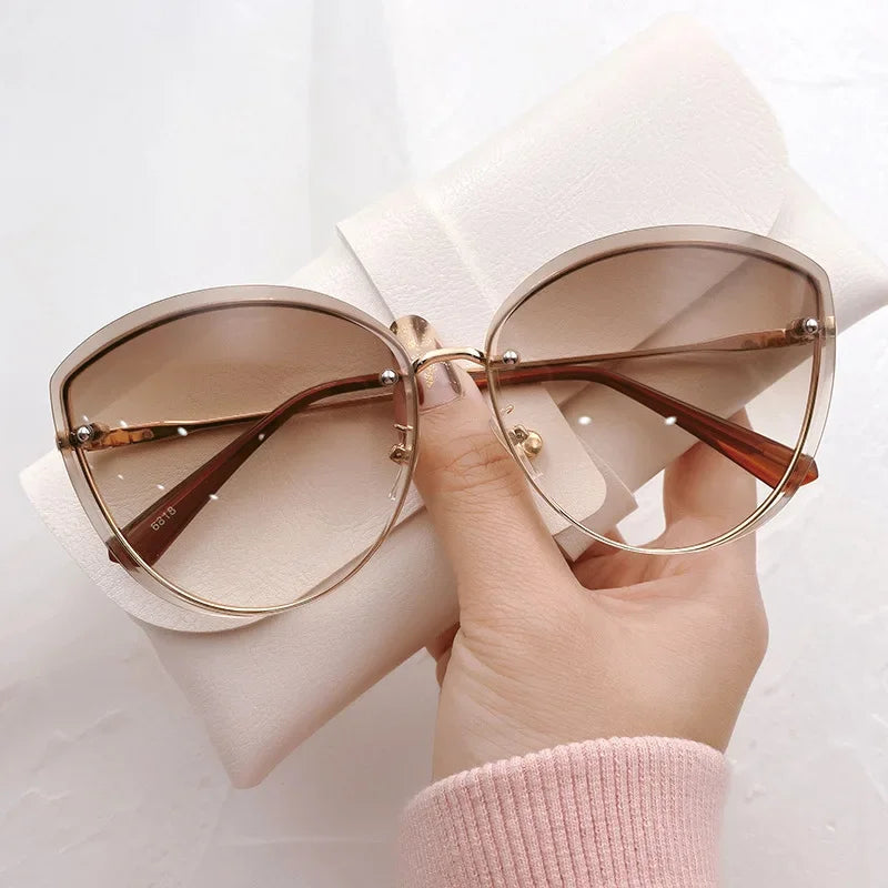 High Quality women's Oval Rimless Sunglasses